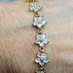 18K gold plated bracelet,white cubic zirconia flowers.NWOT. 7.75”.Perfect GIFT !